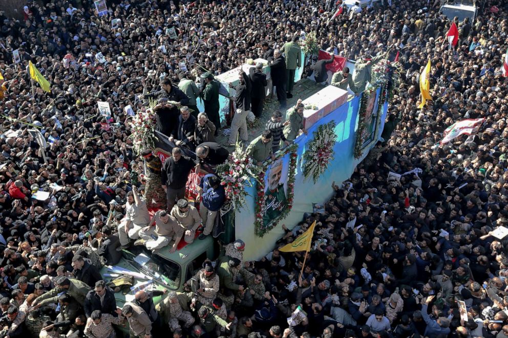 PHOTO: Coffins of Gen. Qassem Soleimani and others who were killed in Iraq by a U.S. drone strike, are carried on a truck surrounded by mourners during a funeral procession, in the city of Kerman, Iran, Jan. 7, 2020.