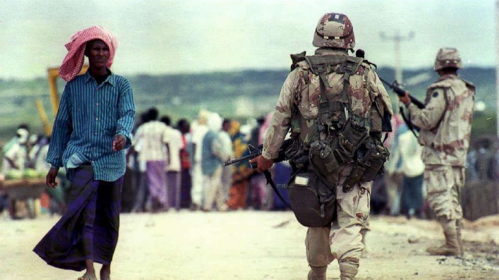 PHOTO: U.S. soldiers patrol near Camp Victory Base in Somalia, Nov. 14, 1993. 