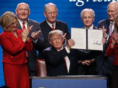 PHOTO: President Donald Trump holds up an executive order after signing it at the American Farm Bureau Federation annual convention Monday, Jan. 8, 2018, in Nashville, Tenn.