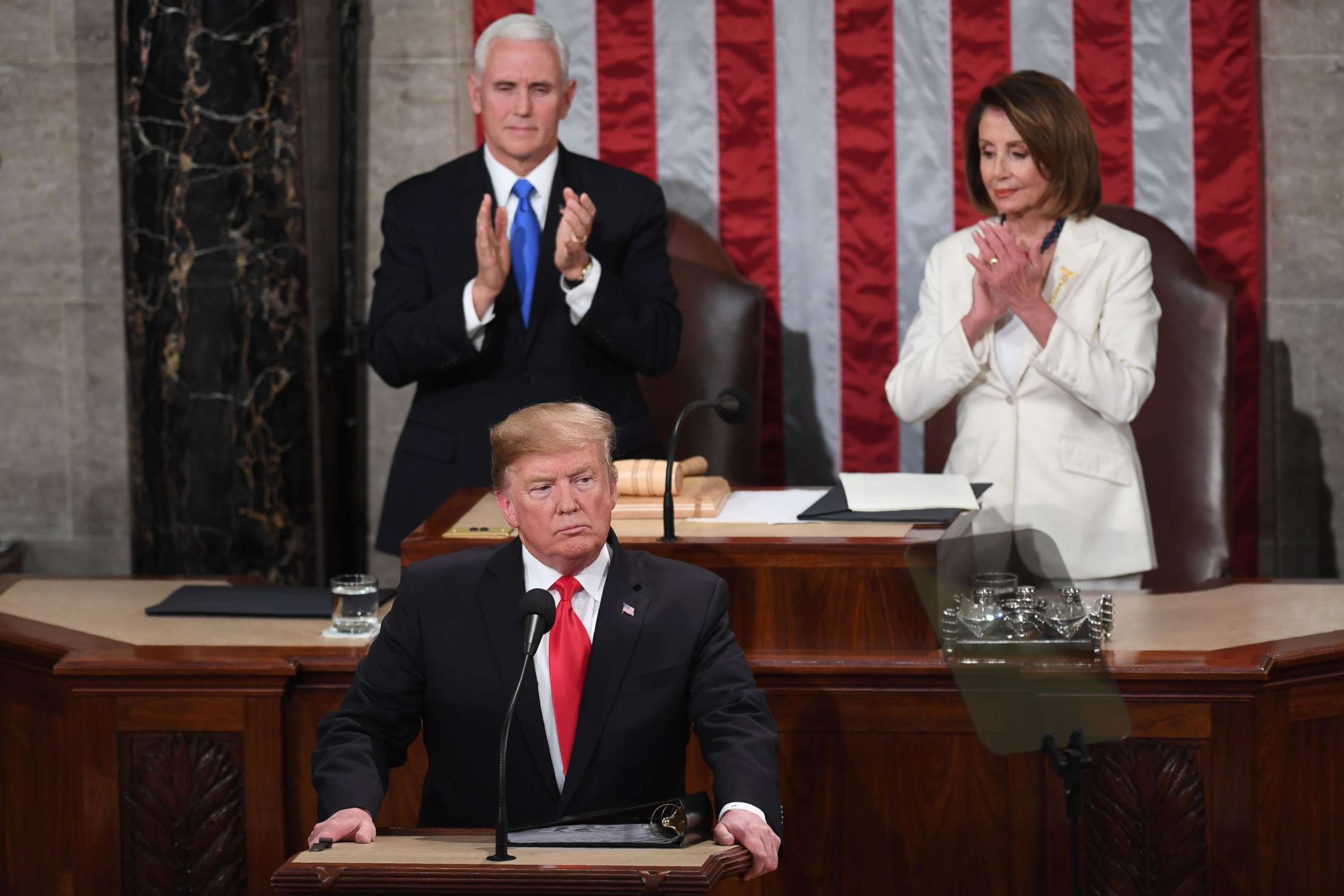 PHOTO: President Donald Trump, flanked by speaker of the U.S. House of Representatives Nancy Pelosi and Vice President Mike Pence, takes the podium to deliver the State of the Union address in Washington, Feb. 5, 2019.