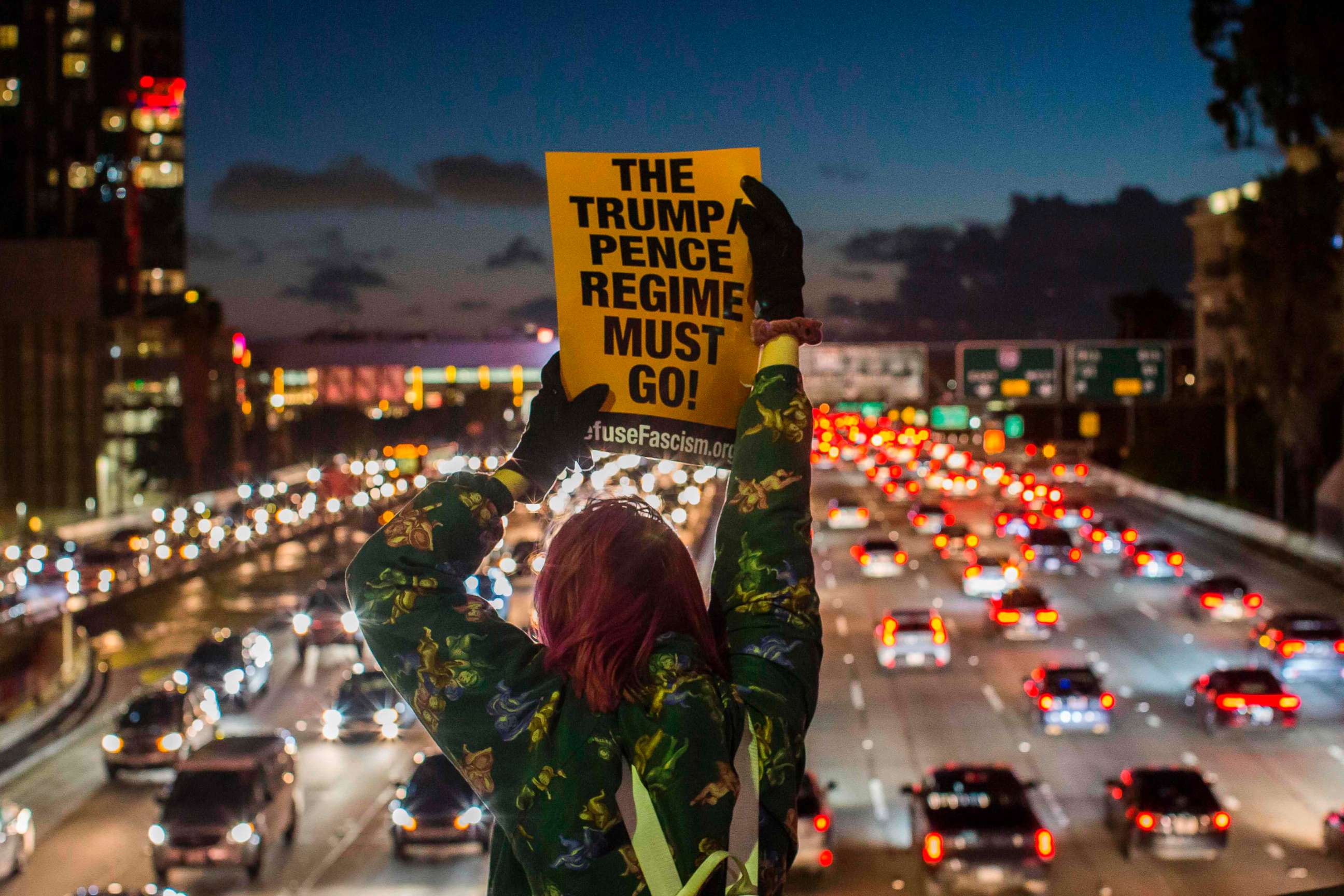 PHOTO: Protestors shout slogans and hold signs during the State of the Union protest on a freeway overpass in downtown Los Angeles, Feb. 05, 2019.
