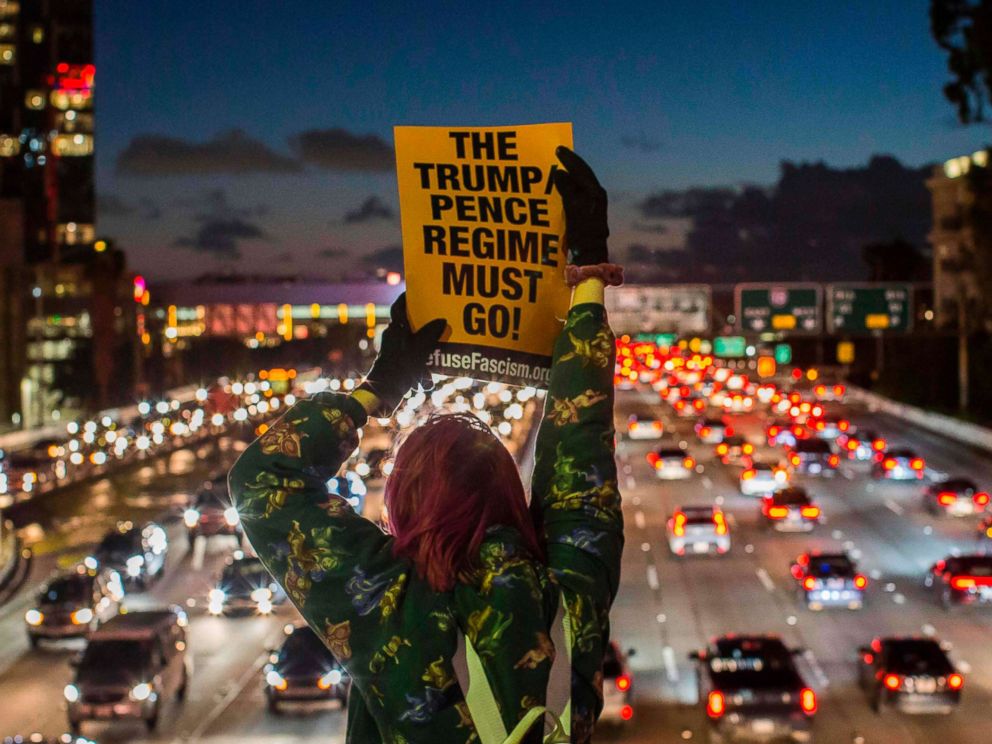 PHOTO: Protestors shout slogans and hold signs during the State of the Union protest on a freeway overpass in downtown Los Angeles, Feb. 05, 2019.