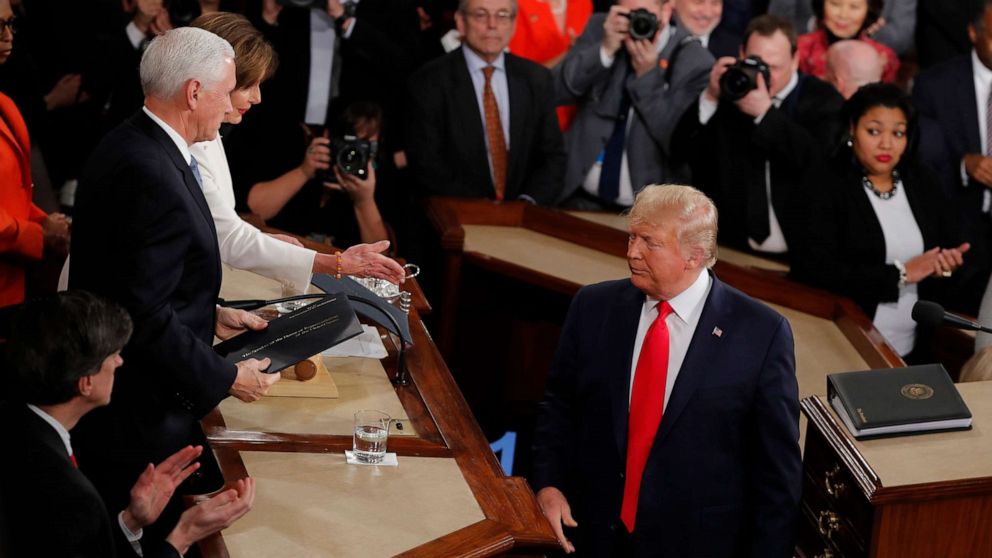 PHOTO: President Donald Trump turns after handing copies of his speech to House Speaker Nancy Pelosi, and Vice President Mike Pence as he delivers his State of the Union address to a joint session of Congress on Capitol Hill in Washington, Feb. 4, 2020.