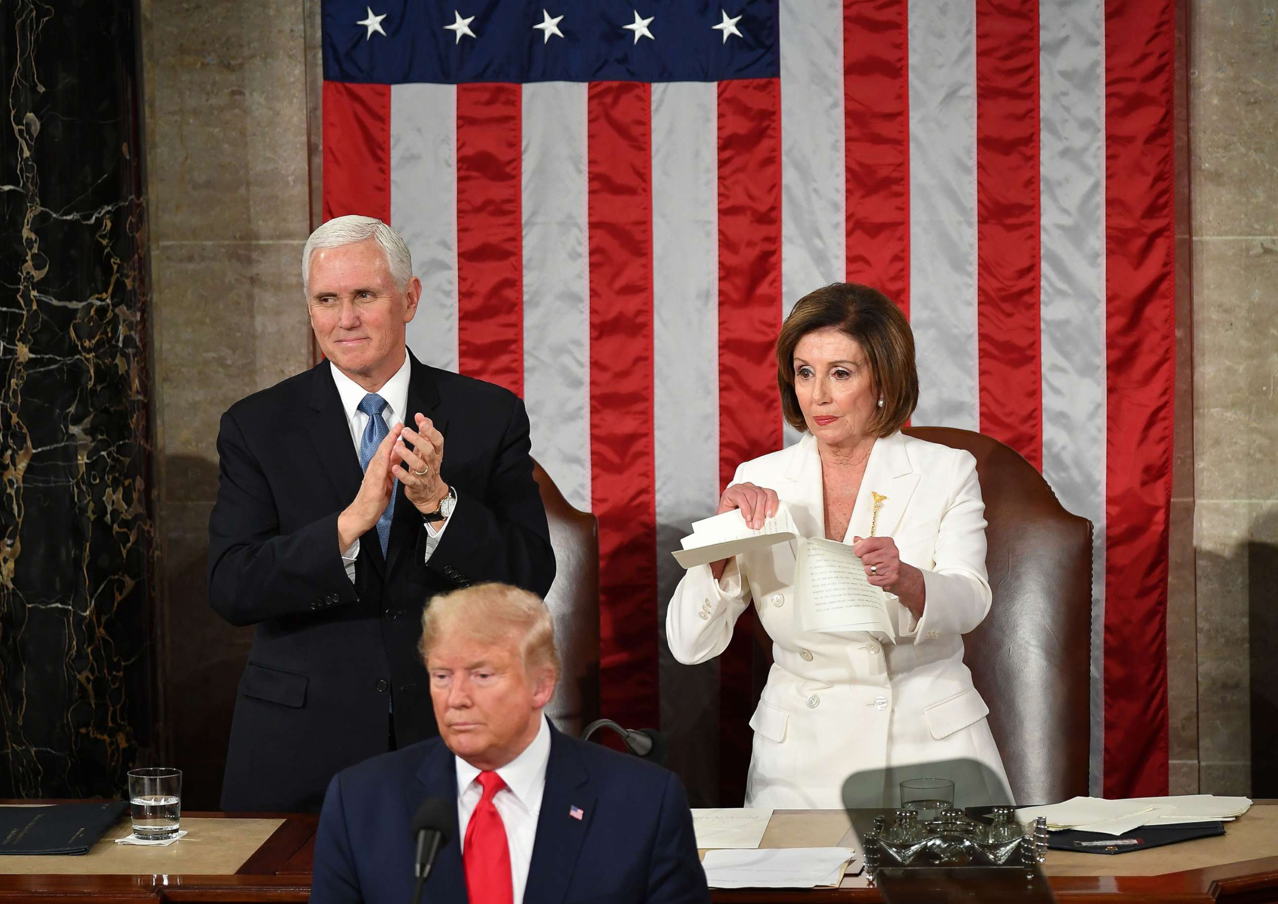PHOTO: Vice President Mike Pence claps as Speaker of the House Nancy Pelosi rips a copy of President Donald Trump speech after he delivers the State of the Union address at the US Capitol in Washington, Feb. 4, 2020.