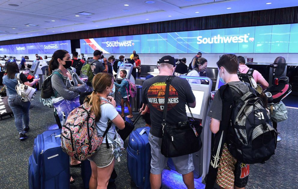 PHOTO: Travelers check-in for a Southwest Airlines flight at Orlando International Airport on July 2, 2021, in Orlando, Fla.