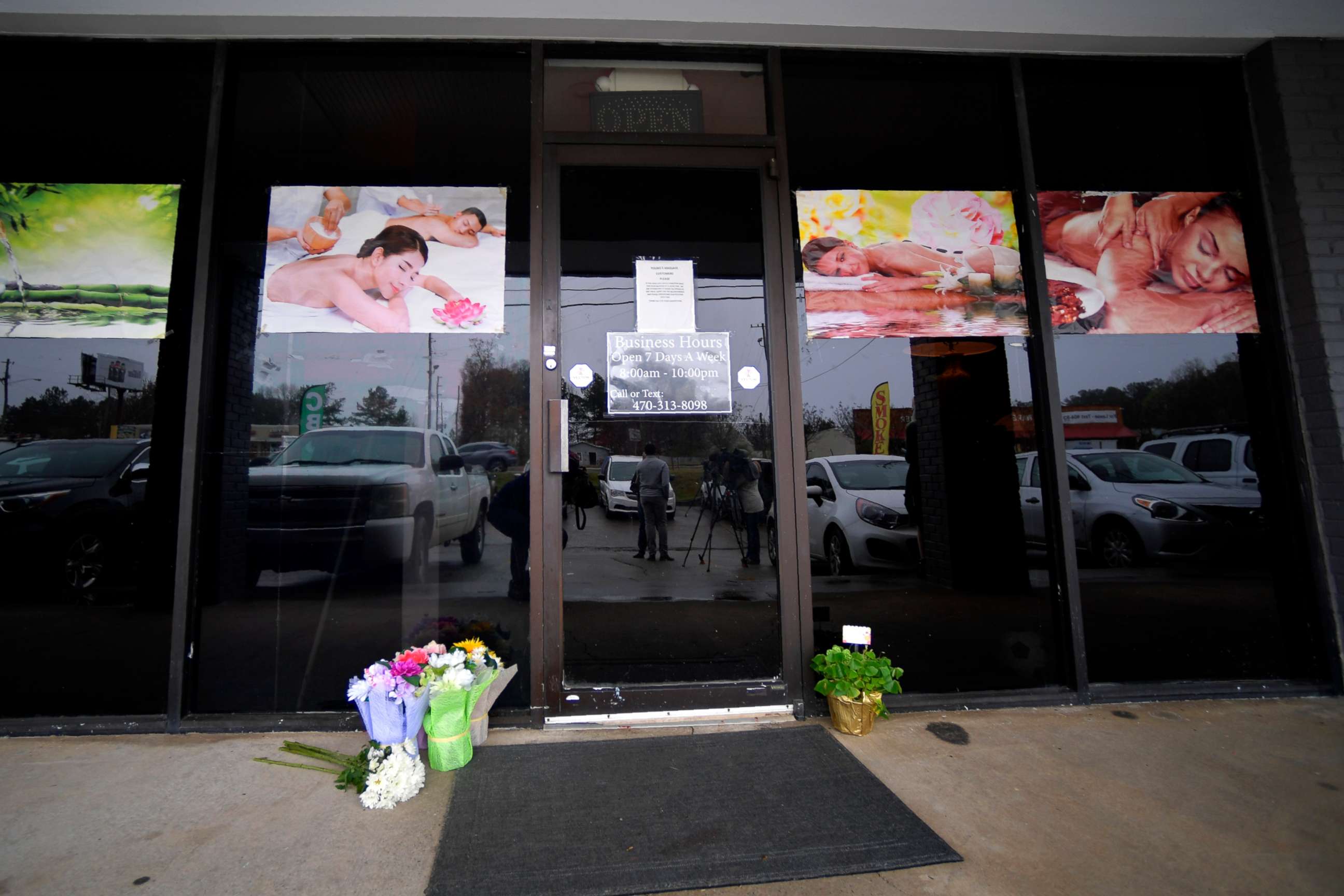 PHOTO: A make-shift memorial is seen outside a business, March 17, 2021, where a multiple fatal shooting occurred the day before, in Acworth, Ga.