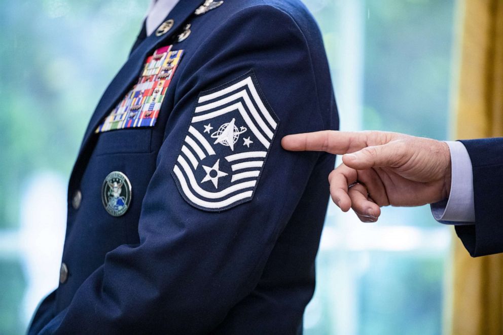 PHOTO: Chief Master Sgt. Roger Towberman displays his insignia during a presentation of the United States Space Force flag in the Oval Office of the White House, Friday, May 15, 2020.