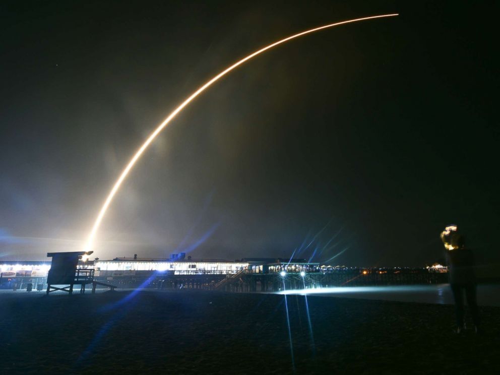 PHOTO: People watch SpaceXs Falcon 9 rocket PSN VI launch from Cape Canaveral Air Force Station, Fla., Feb. 21, 2019 at Cocoa Beach, Fla.
