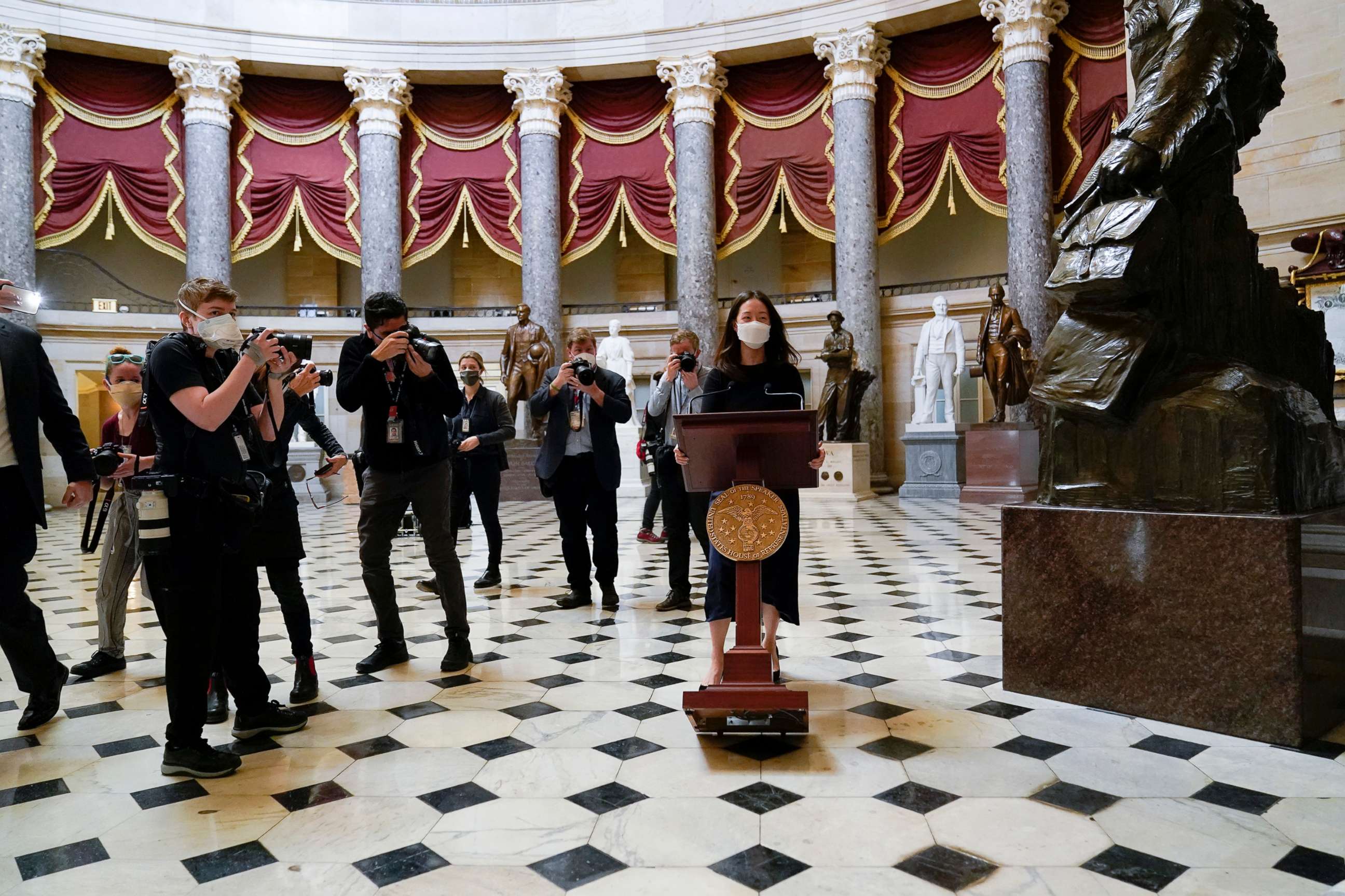 PHOTO: A lectern belonging to Speaker of the House Nancy Pelosi is moved through Statuary Hall for a news conference, Jan. 13, 2021, at the U.S. Capitol in Washington, D.C. 