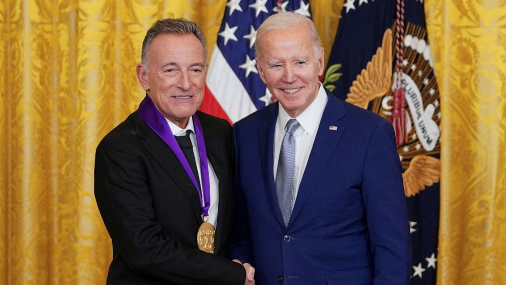 PHOTO: National Medal of Arts recipient, musician Bruce Springsteen shakes hands with President Joe Biden after the president presented Springsteen with his medal during a ceremony in the East Room at the White House in Washington, D.C., March 21, 2023.
