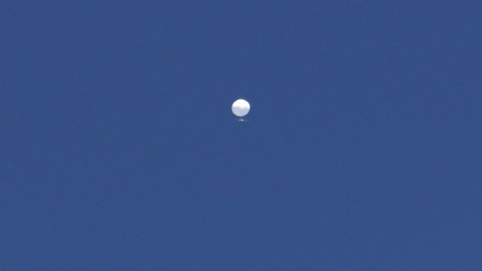 PHOTO: A balloon floats over Columbia, Mo., on Feb. 3, 2023. A huge, high-altitude Chinese balloon sailed across the U.S. on Friday, drawing severe Pentagon accusations of spying despite China's firm denials.