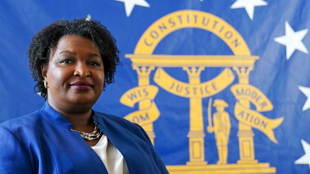 PHOTO: Democratic candidate for Georgia governor Stacey Abrams poses for a portrait in front of the State Seal of Georgia on Aug. 8, 2022, in Decatur, Ga.