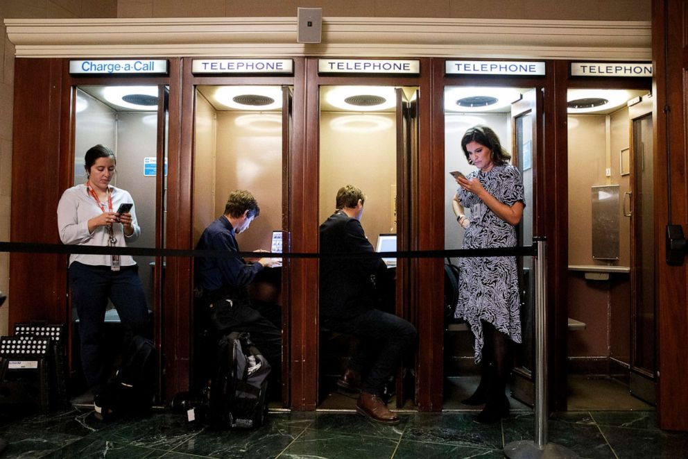 PHOTO: Journalists file after the arrival of the two witnesses, Nov. 13, 2019, on Capitol Hill in Washington, D.C., during the first public impeachment hearings of President Donald Trump.