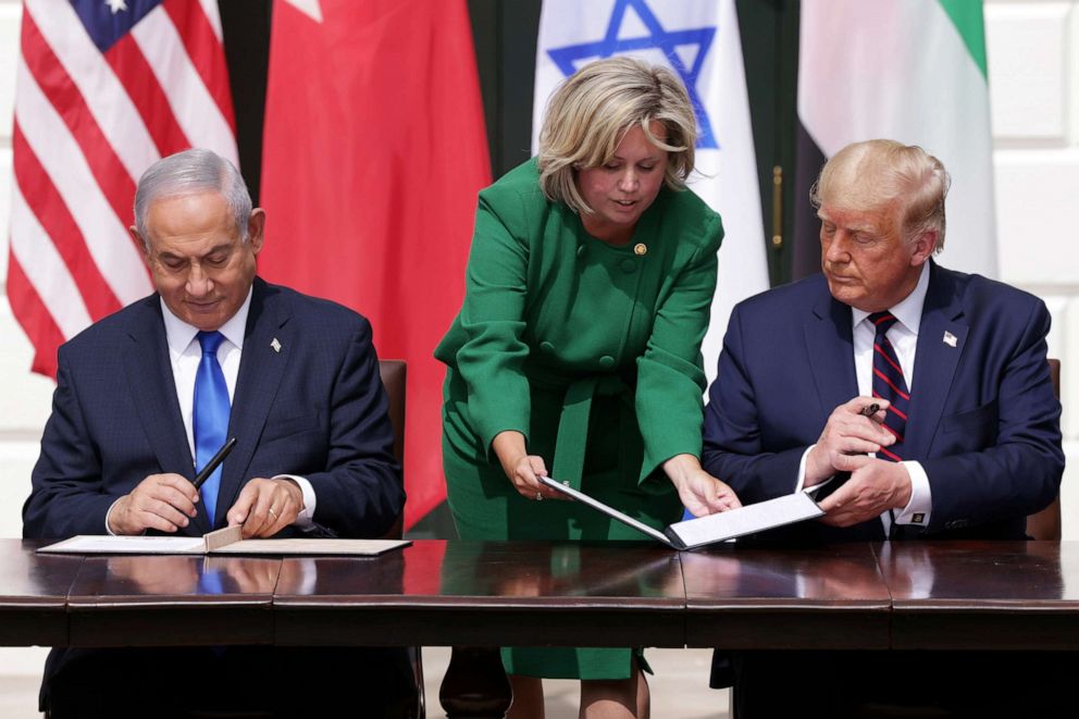 PHOTO: Prime Minister of Israel Benjamin Netanyahu and President Donald Trump participate in the signing ceremony of the Abraham Accords, assisted by U.S. chief of protocol Cam Henderson, on the South Lawn of the White House, Sept. 15, 2020.