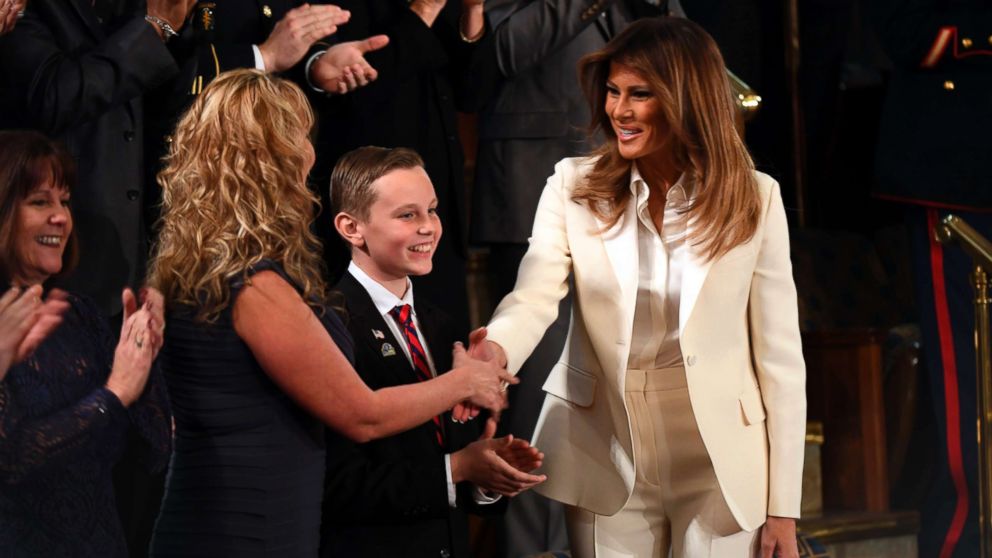 First Lady Melania Trump shakes hands with one of the guests after arriving for the President's State of the Union address from the House chamber, Jan. 30. 2018.
