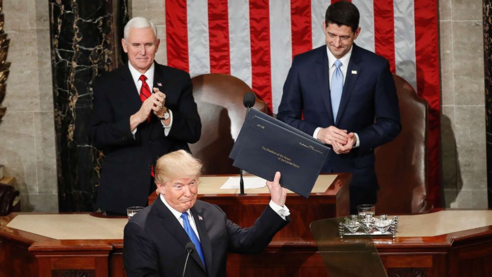 PHOTO: President Donald Trump holds up copies of his speech upon arrival and before delivering his State of the Union address to a joint session of Congress on Capitol Hill in Washington, Jan. 30, 2018.