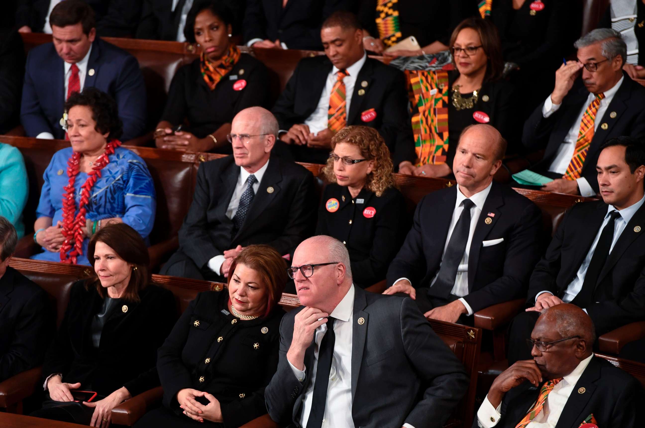 PHOTO: Democratic Senators, House representative, and guests sit and look on as President Donald Trump delivers the State of the Union address at the US Capitol in Washington, Jan. 30, 2018.