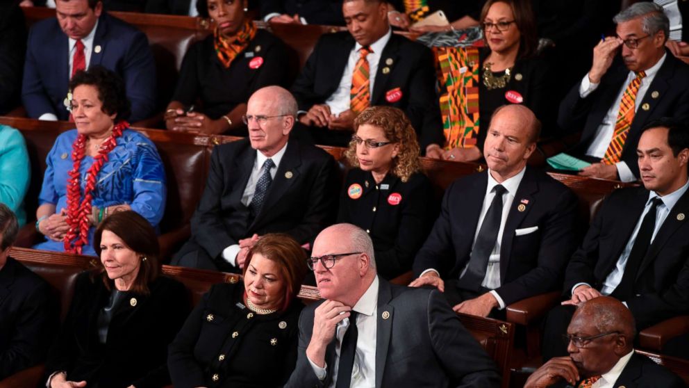 PHOTO: Democratic Senators, House representative, and guests sit and look on as President Donald Trump delivers the State of the Union address at the US Capitol in Washington, Jan. 30, 2018.
