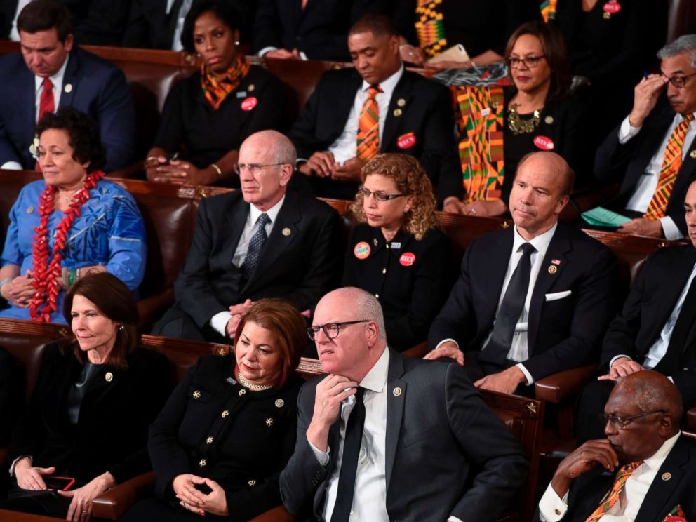 PHOTO: Democratic Senators, House representative, and guests sit and look on as President Donald Trump delivers the State of the Union address at the US Capitol in Washington, Jan. 30, 2018.