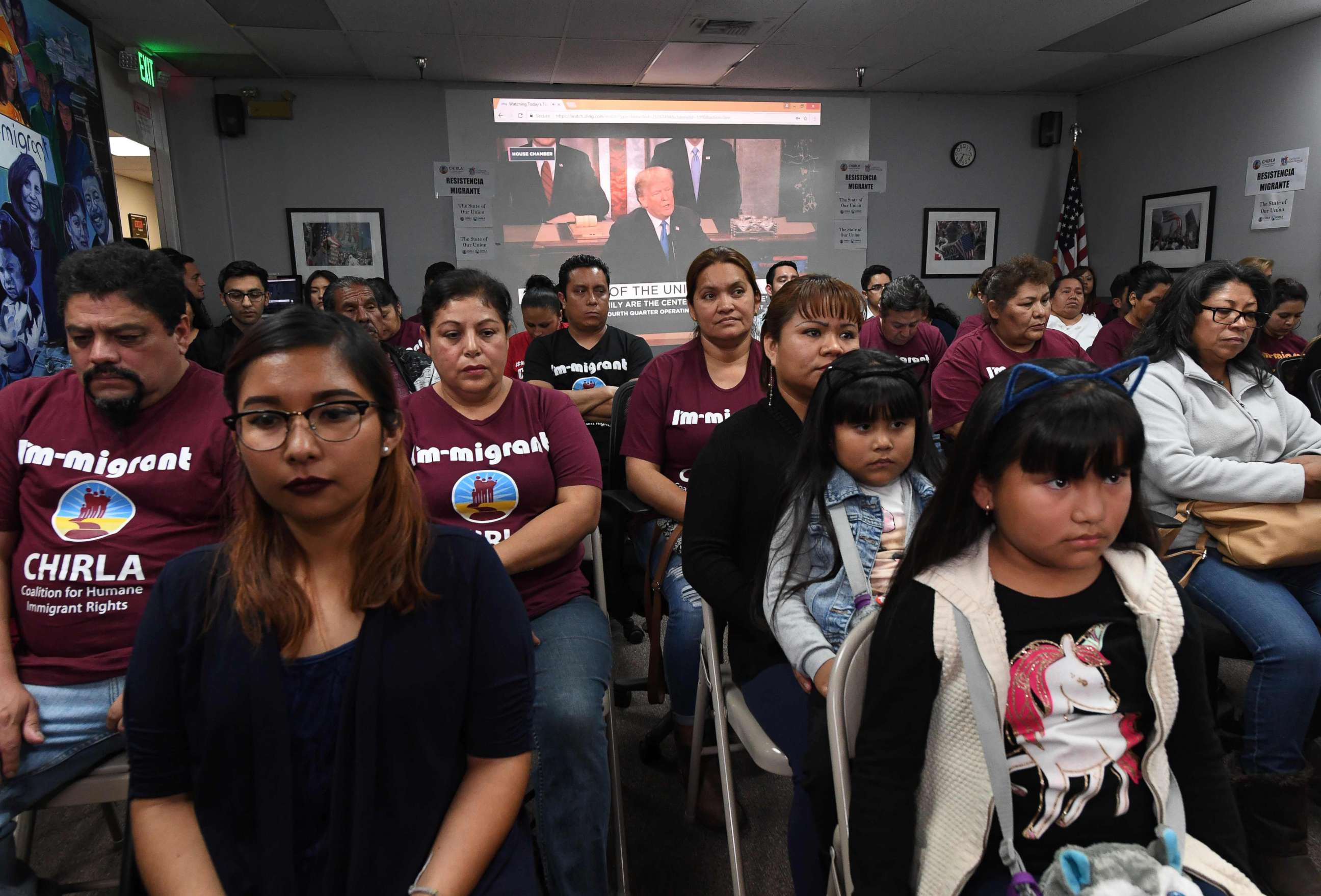 PHOTO: DACA recipients and their supporters turn their back on an image showing President Trump during a State of the Union party at the Coalition for Humane Immigrant Rights and the California Dream Network offices in Los Angeles, Jan. 30, 2018.