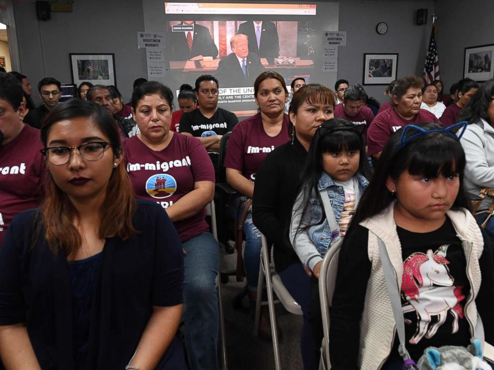 PHOTO: DACA recipients and their supporters turn their back on an image showing President Trump during a State of the Union party at the Coalition for Humane Immigrant Rights and the California Dream Network offices in Los Angeles, Jan. 30, 2018.