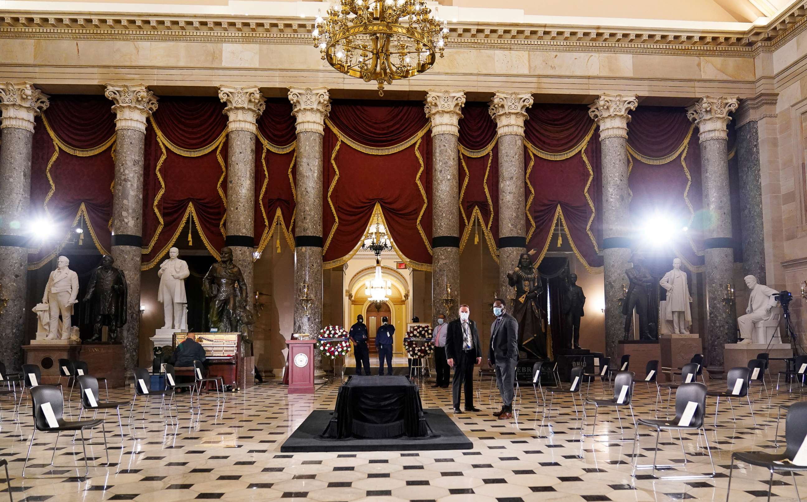 PHOTO: Final preparations are being made in Statuary Hall of the U.S. Capitol for Justice Ruth Bader Ginsburg, who will lie in state later today, in Washington, U.S., September 25, 2020. Alex Brandon/Pool via REUTERS