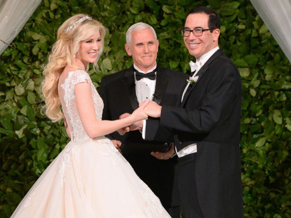 PHOTO: Vice President Mike Pence, center, officiates the wedding of Louise Linton, left, and Secretary of the Treasury Steven Mnuchin, June 24, 2017 at Andrew Mellon Auditorium in Washington, D.C.