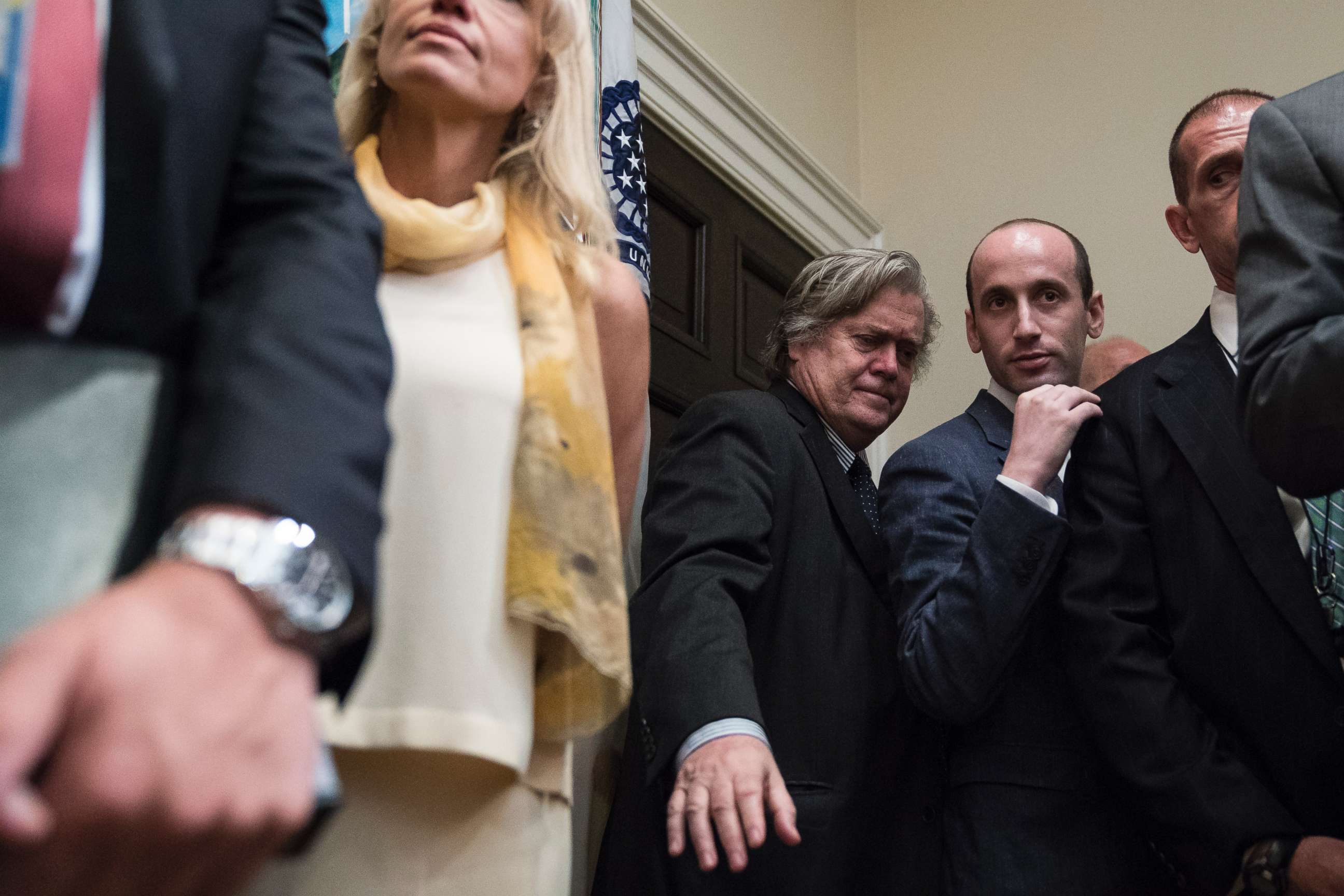 PHOTO: Steve Bannon stands with other senior White House staff as President Donald Trump and others unveil legislation to place new limits on legal immigration in the Roosevelt Room of the White House in Washington, Aug 02, 2017.