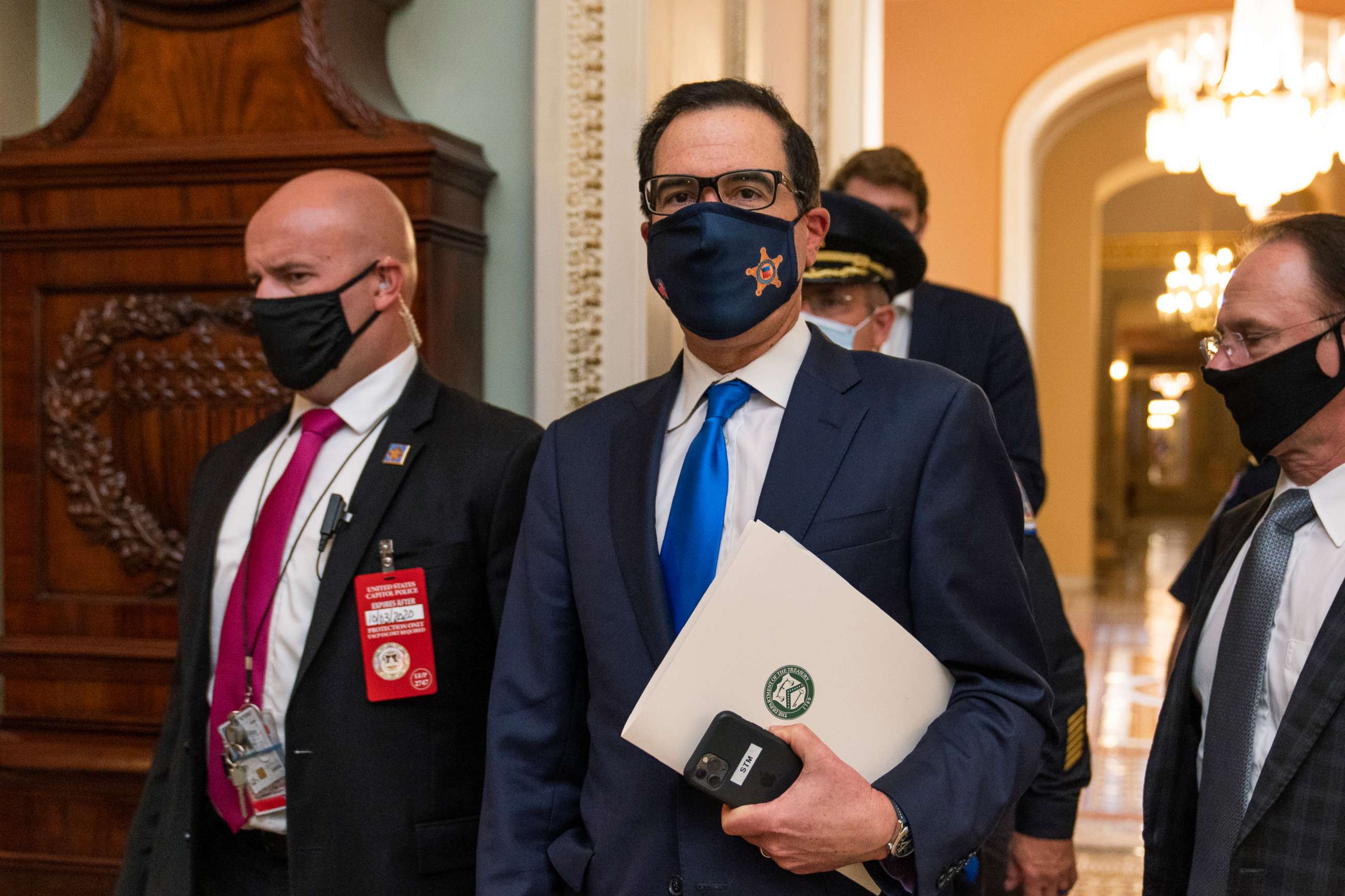 PHOTO: Treasury Secretary Steven Mnuchin, center, makes a brief comment as he leaves the Capitol, Sept. 30, 2020, in Washington.