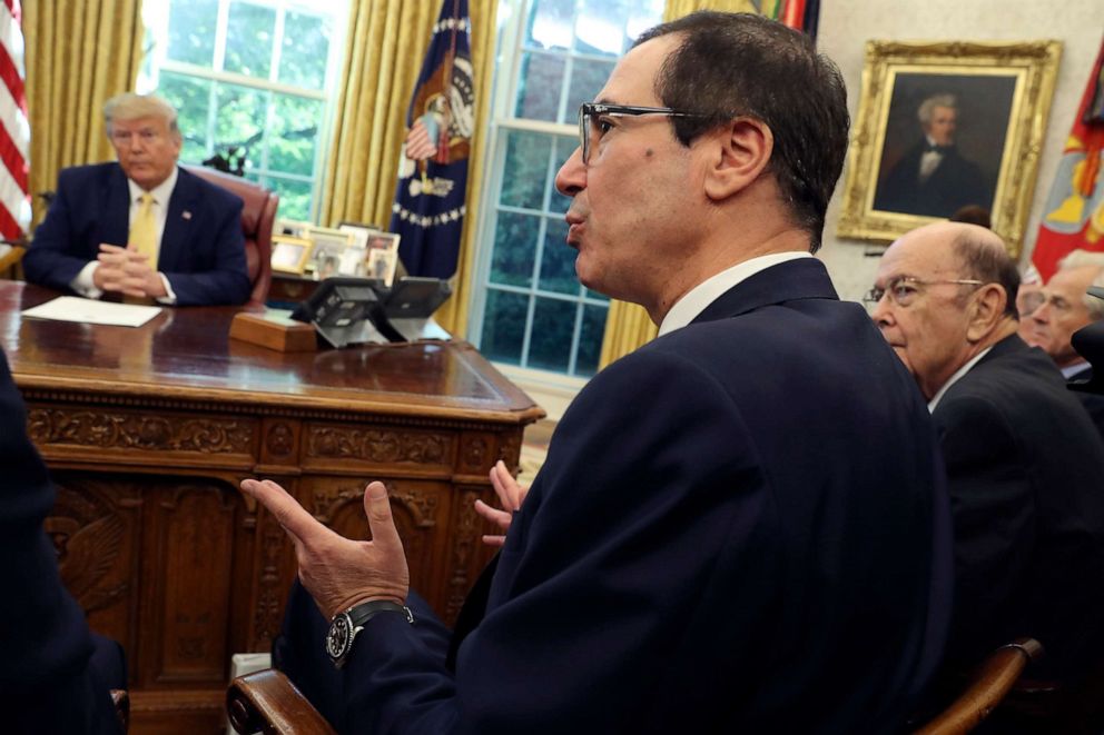 PHOTO: Treasury Secretary Steven Mnuchin speaks as Commerce Secretary Wilbur Ross, right, listens with President Donald Trump during their meeting with Vice Premier Liu He in the Oval Office of the White House in Washington, Oct. 11, 2019.