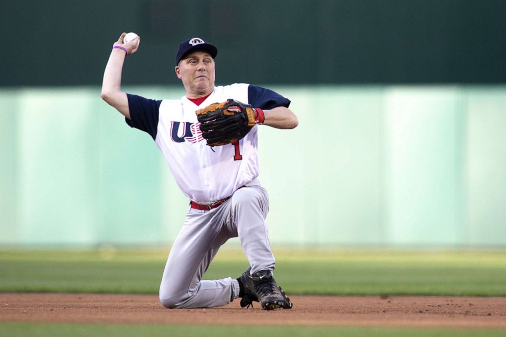 PHOTO: Rep Steve Scalise makes a play to first base resulting in an out after fielding a ground ball on the first pitch of the Congressional Baseball Game, June 14, 2018, in Washington, DC.