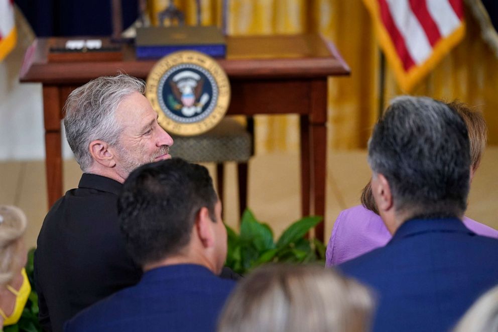 PHOTO: Activist and entertainer Jon Stewart arrives for the signing ceremony of the "PACT Act of 2022" with President Joe Biden in the East Room of the White House, Aug. 10, 2022.