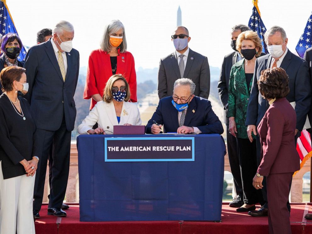 PHOTO: Speaker of the House Nancy Pelosi and Senate Majority Leader Chuck Schumer, sign the American Rescue Plan COVID relief bill during an enrollment ceremony, at the Capitol, March 10, 2021.