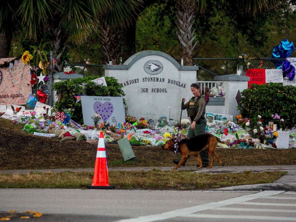PHOTO: A Broward County sheriffs deputy with the K-9 unit patrols outside Marjory Stoneman Douglas High School in Parkland, Fla., as students arrive on Wednesday, Feb. 28, 2018.