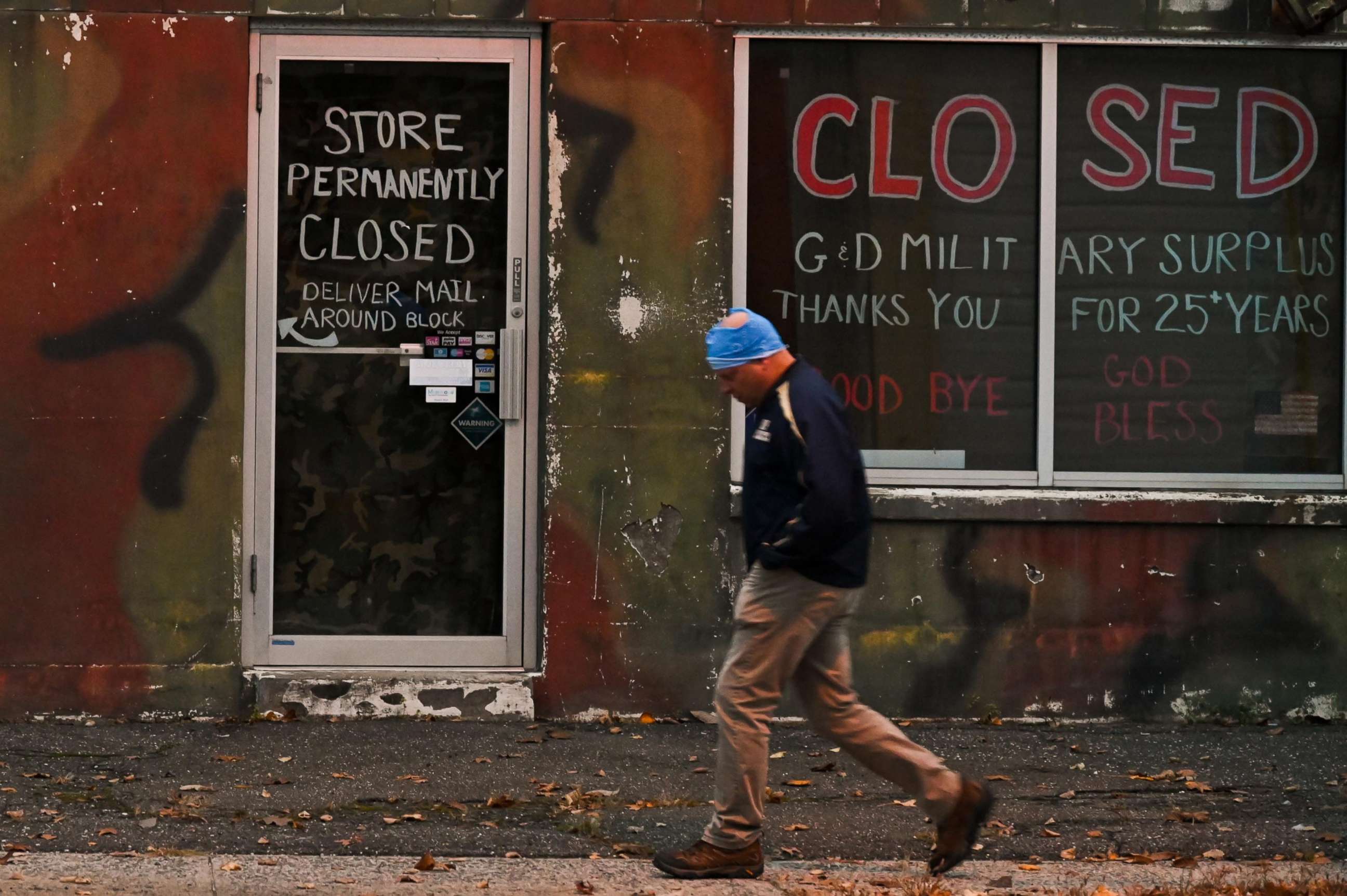 PHOTO: A person passes a closed store in Patchogue, N.Y., on November 12, 2020.