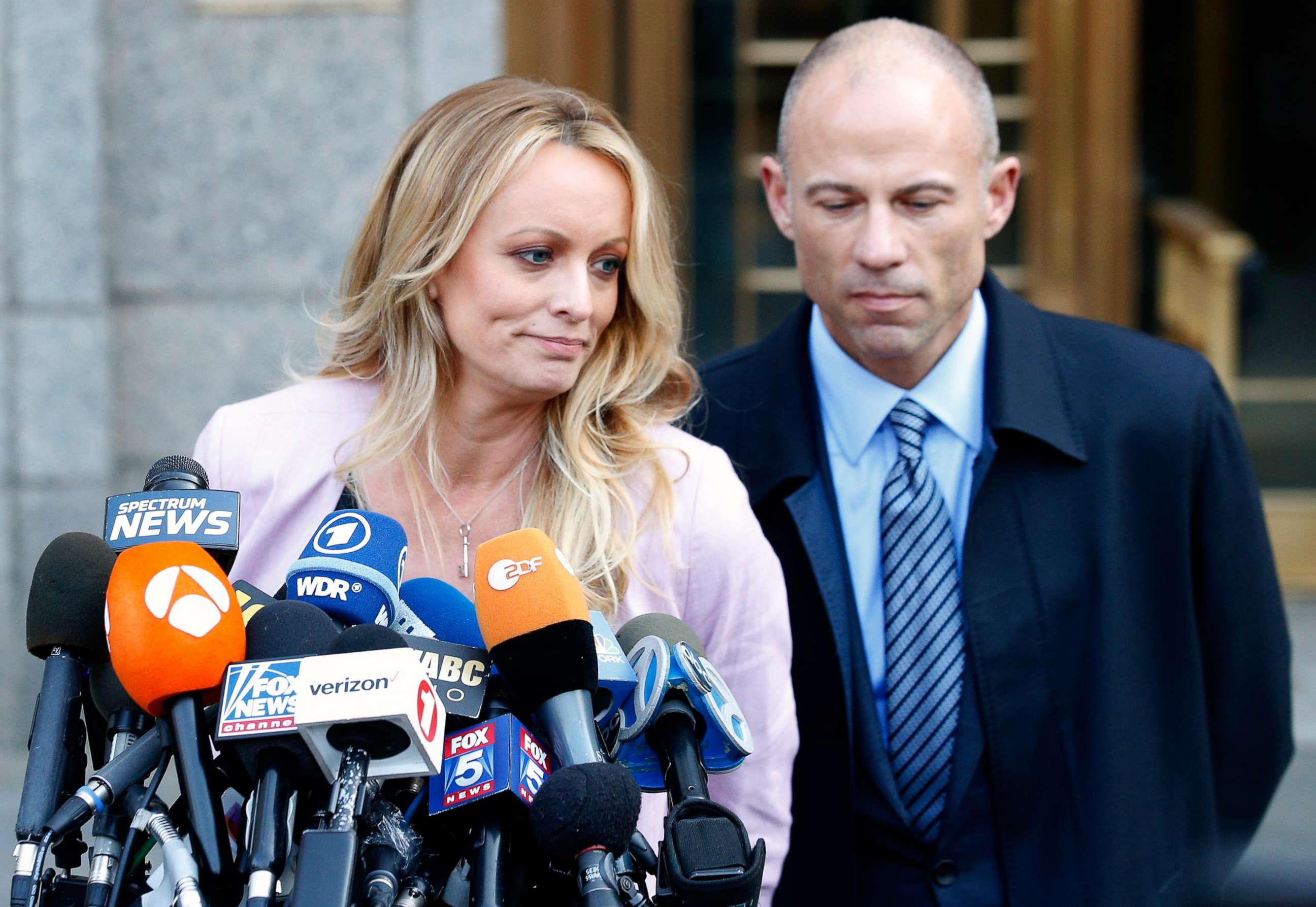 PHOTO: Adult film actress Stephanie Clifford, also known as Stormy Daniels, speaks to media along with lawyer Michael Avenatti (R) outside federal court in New York, April 16, 2018.