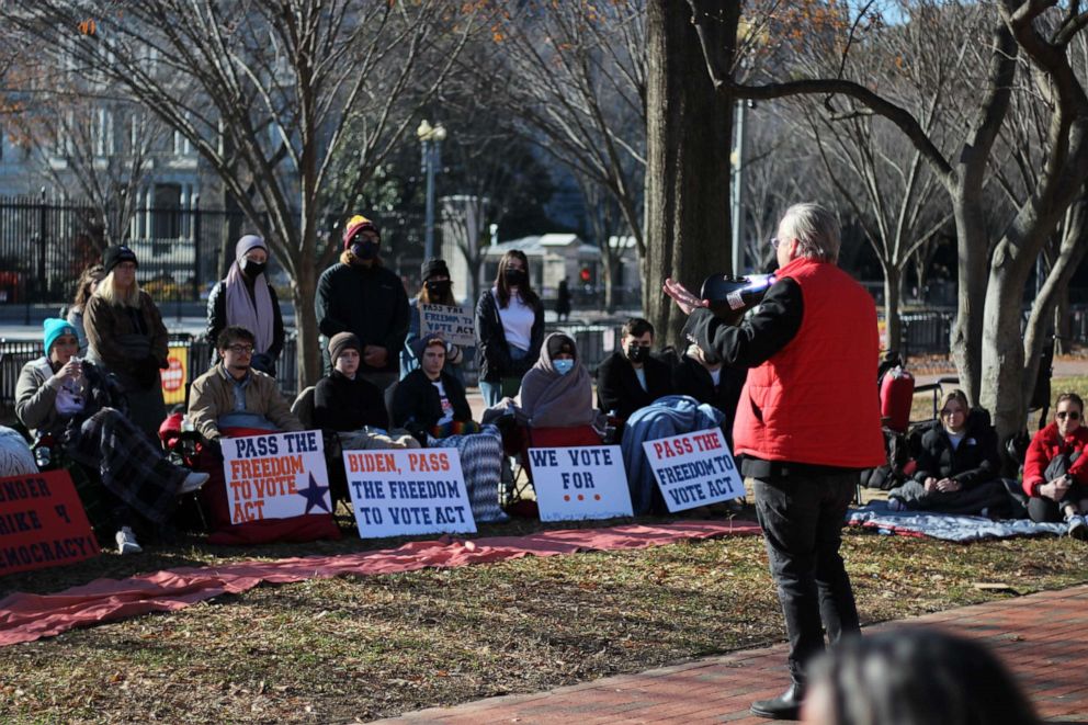 PHOTO: On December 13th, Harvard Professor Lawrence Lessing speaking with protesters. Lessing joined their hunger strike.