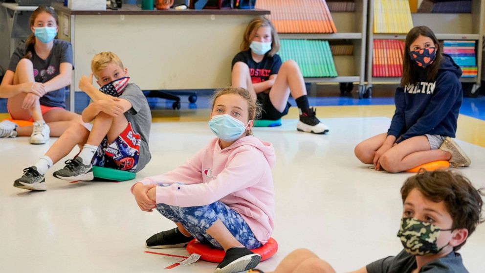 PHOTO: Fifth graders wearing face masks are seated at proper social distancing during a music class at the Milton Elementary School in Rye, N.Y., May 18, 2021.