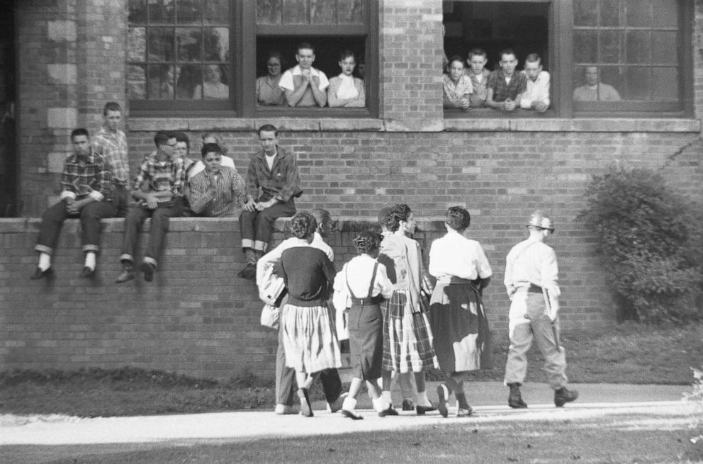 PHOTO: Members of the Little Rock Nine walk into Little Rock Central High School on Oct. 16, 1957, after the Supreme Court ordered the end of "separate but equal" schools in the landmark Brown v. Board of Education decision.