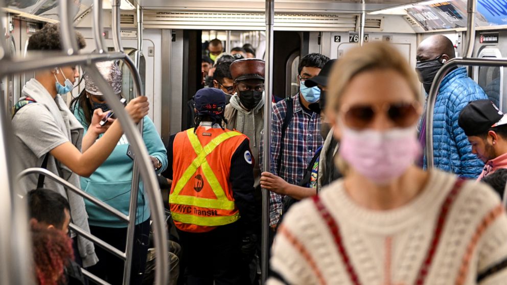 PHOTO: An MTA worker investigates navigates through passengers near Union Square, April 12, 2022 in New York City.
