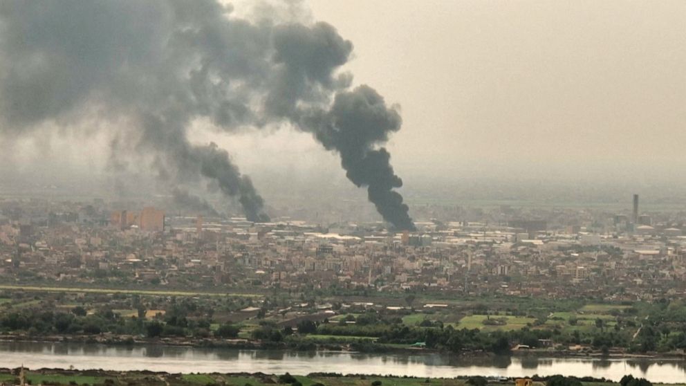 PHOTO: This snapshot taken on April 28, 2023 from AFPTV video footage shows an aerial view of black smoke billowing over Khartoum.