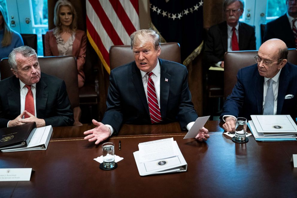 PHOTO: In this Feb. 12, 2019, file photo, President Donald J. Trump, flanked by Deputy Secretary of State John Sullivan and Secretary of Commerce Wilbur Ross, speaks during a cabinet meeting in the Cabinet Room at the White House in Washington, DC.