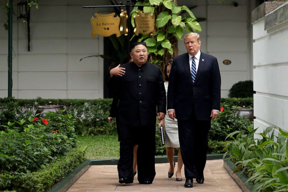 PHOTO: President Donald Trump and North Korean leader Kim Jong Un take a walk after their first meeting on Feb. 28, 2019, in Hanoi, Vietnam.