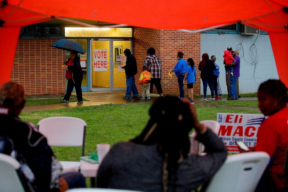 PHOTO: Voters enter a polling station at the National Guard Military Base during the presidential primary in Camden, Ala., on Super Tuesday, March 3, 2020.