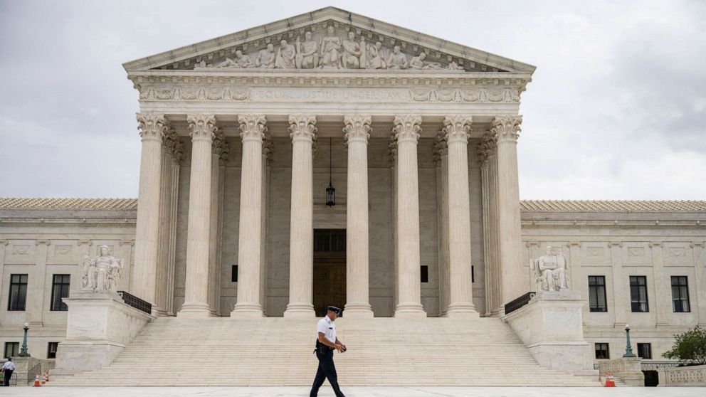 PHOTO: WASHINGTON, DC - SEPTEMBER 01: A Supreme Court Police officer patrols at the U.S. Supreme Court on September 1, 2021 in Washington, DC. 