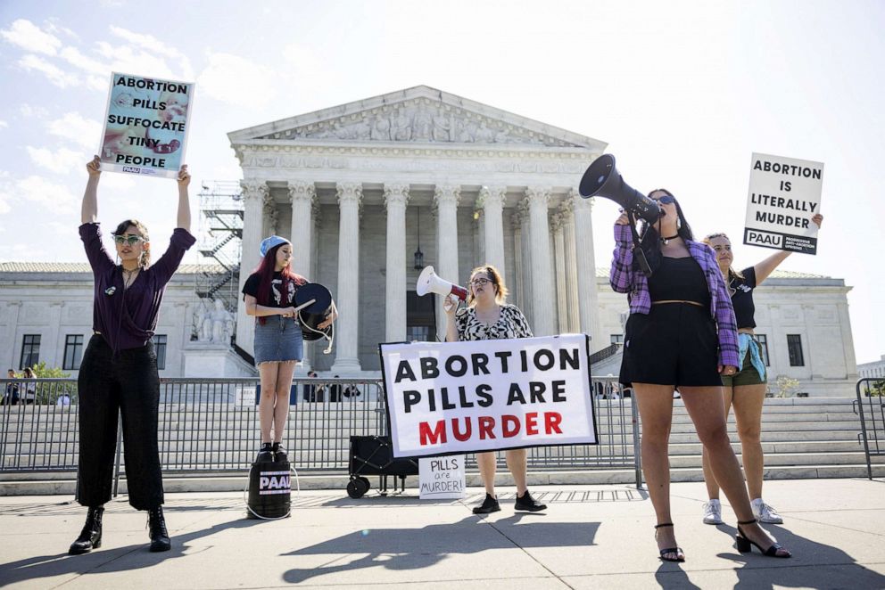 PHOTO: Anti-abortion protesters gather outside the US Supreme Court as the justices prepare to issue an order on whether women will face restrictions procuring the abortion pill mifepristone at the Supreme Court in Washington, D.C., on April 21, 2023.
