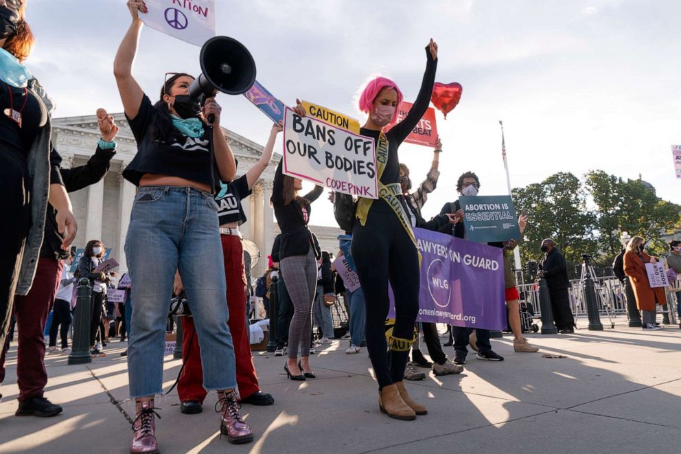 PHOTO: Abortion-rights and anti-abortion activists rally outside the Supreme Court, Nov. 1, 2021, as arguments are set to begin about abortion by the court, in Washington, D.C.