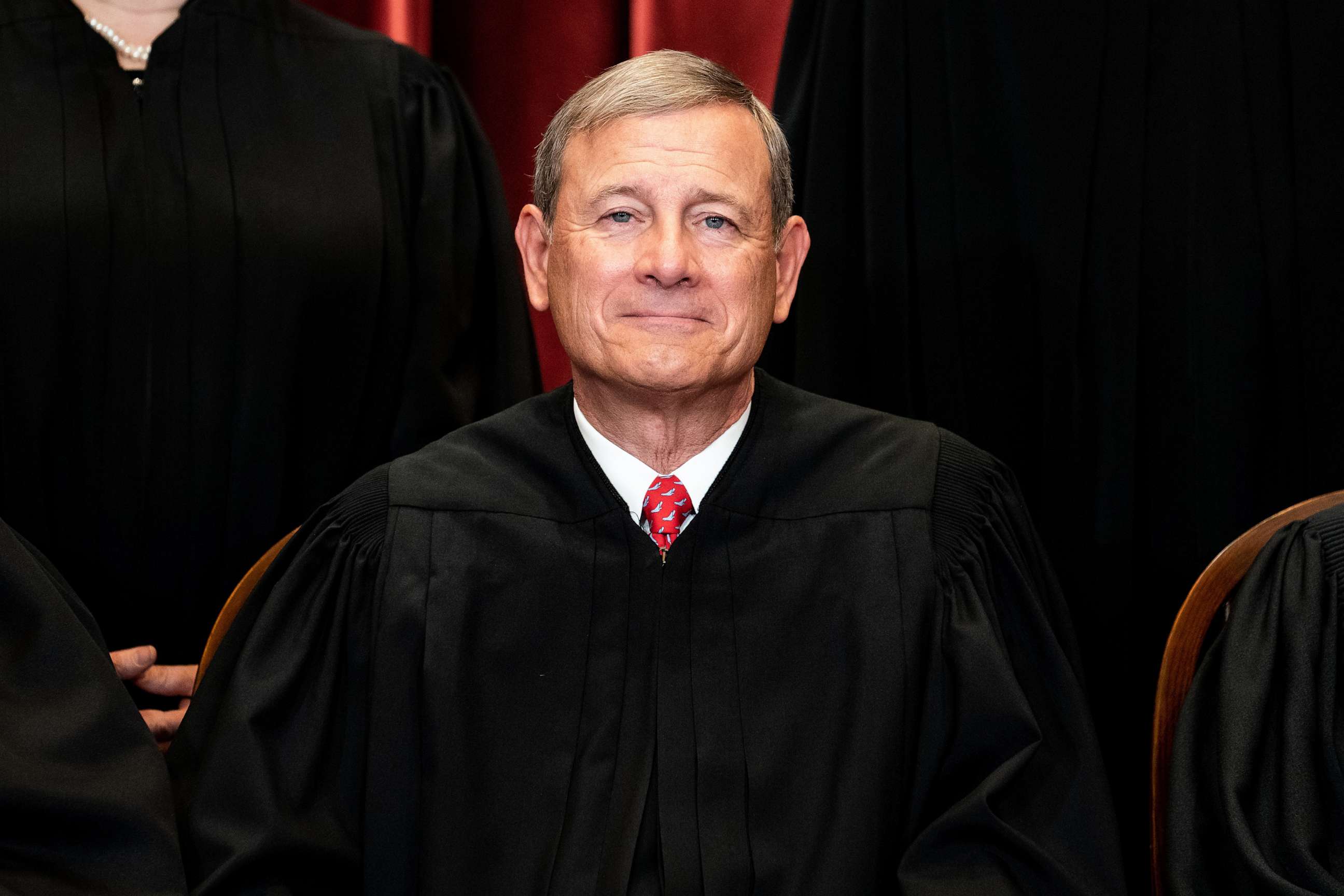 PHOTO: Chief Justice John Roberts sits during a group photo of the Justices at the Supreme Court in Washington, April 23, 2021.