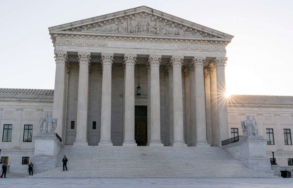 PHOTO: The sun rises behind the U.S. Supreme Court, Oct. 11, 2022, in Washington. 