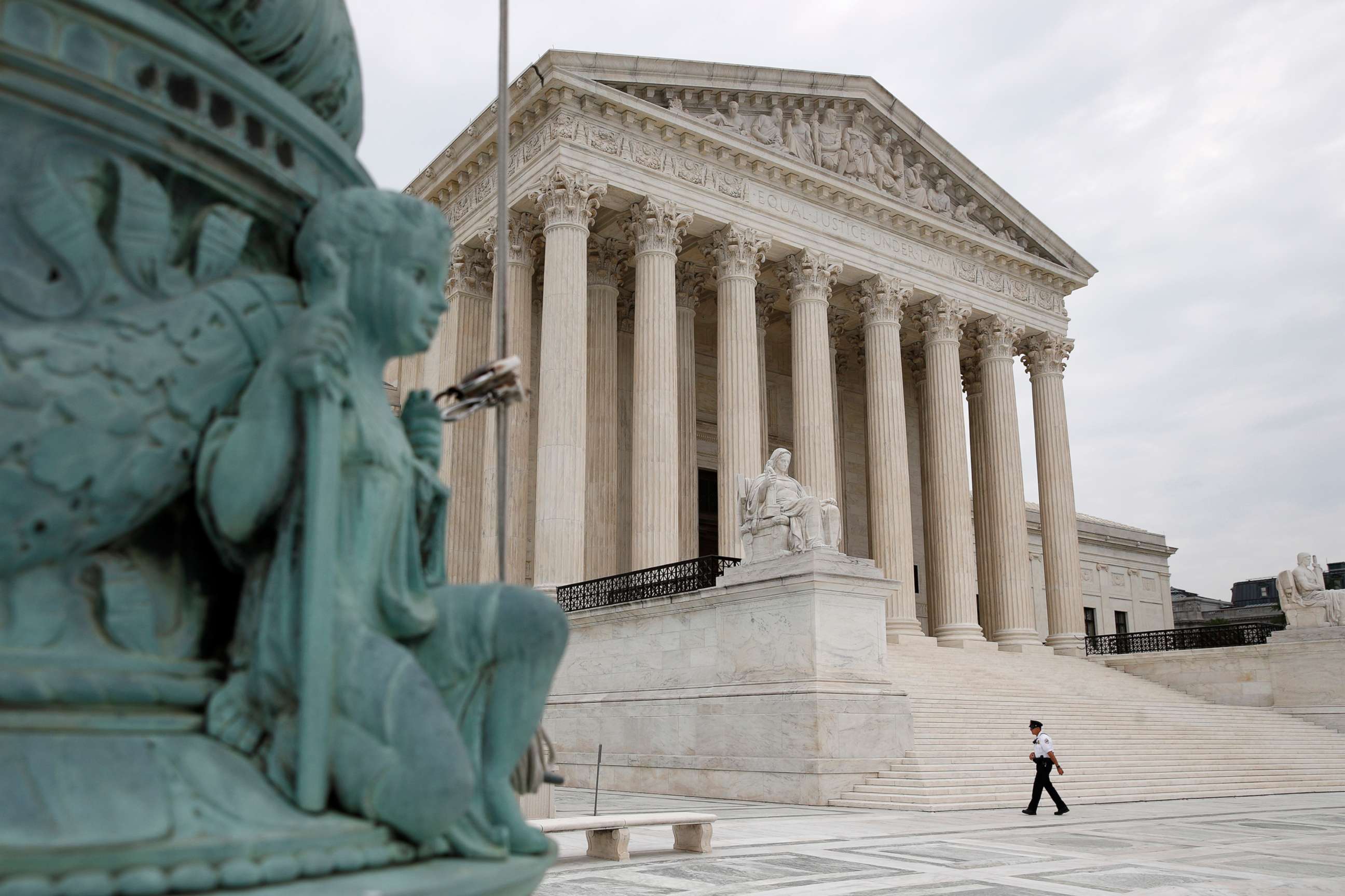 PHOTO: A police officer walks outside the Supreme Court on Capitol Hill in Washington, D.C., July 6, 2020.